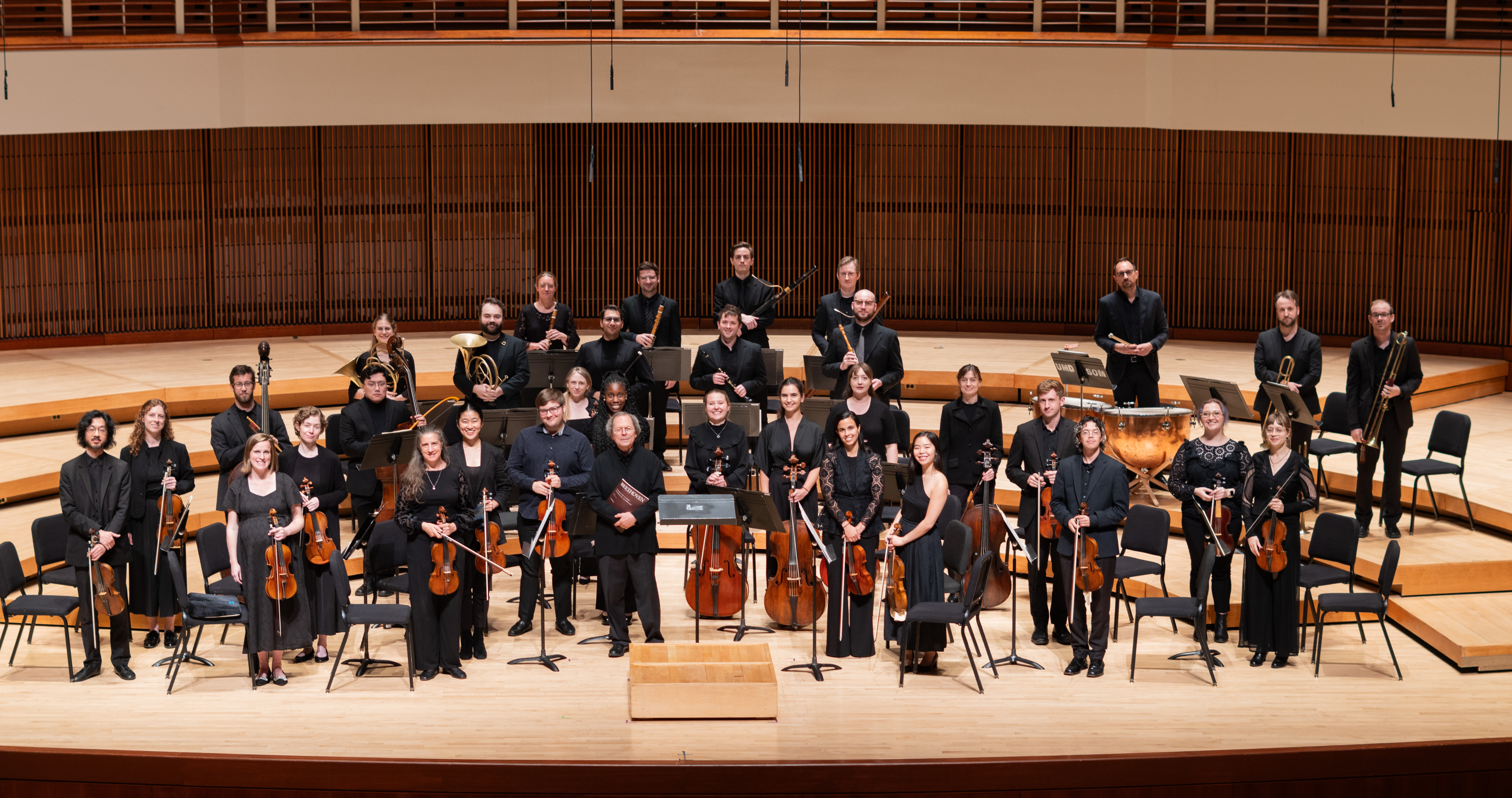 Members of the Smithsonian Academy Orchestra on stage